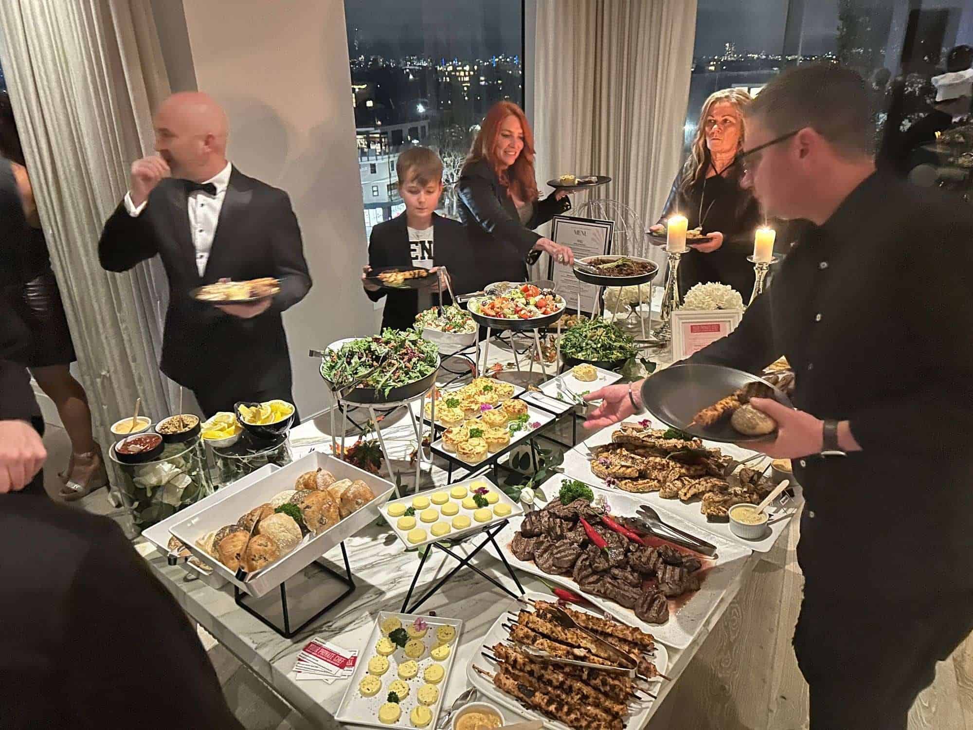 Elegant buffet dinner served by professional private chefs at a sophisticated event in Sydney.